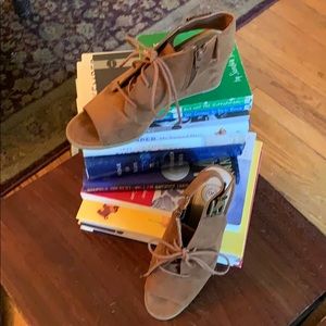 Brown faux suede open toe/heel wedges.